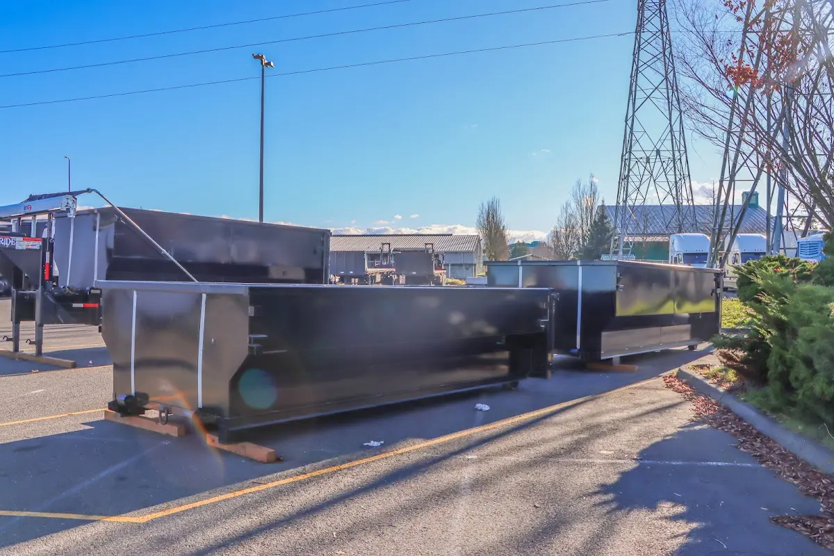 Roll-off dumpster ready for waste disposal at job site for Yard Waste Dumpster Rental in Webster City